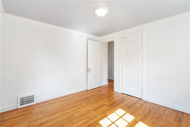 unfurnished bedroom featuring light wood-type flooring