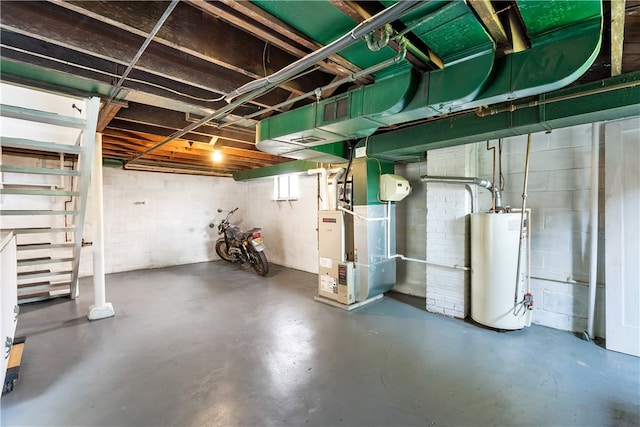 basement featuring water heater and heating unit