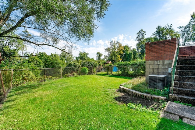 view of yard with central AC unit