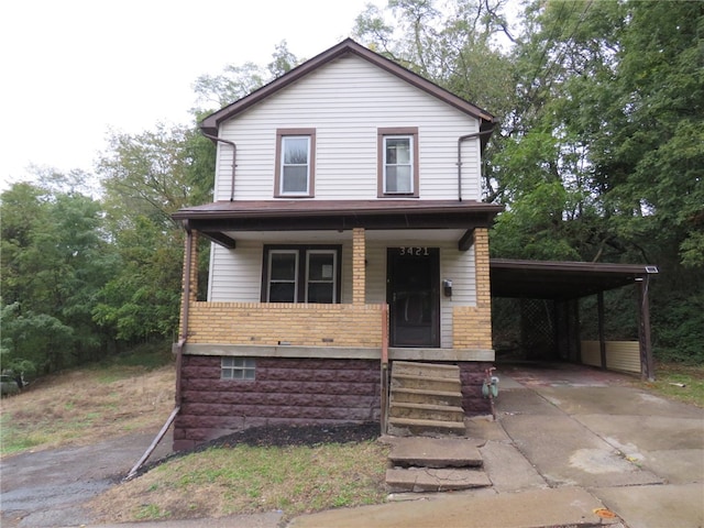 view of front of house with a carport and covered porch