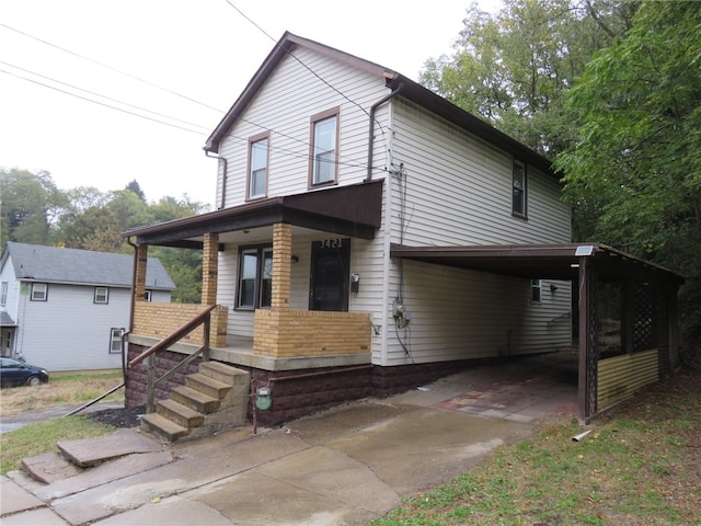 view of front of home with a carport