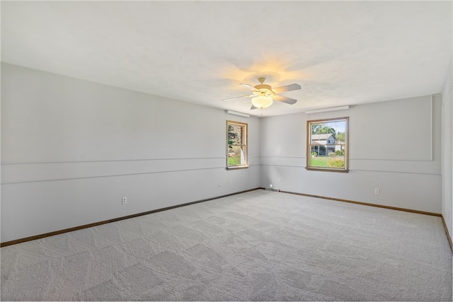 spare room with light carpet and ceiling fan