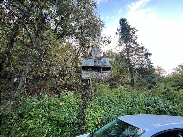 view of side of property featuring a balcony