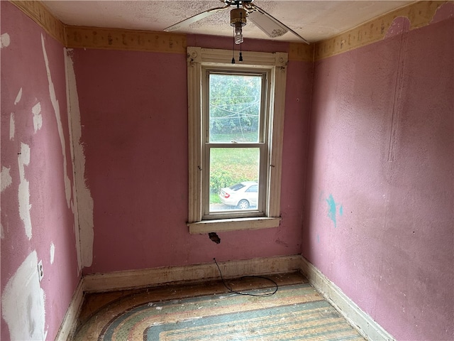 unfurnished room with ceiling fan