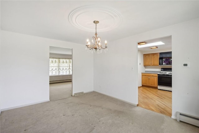 unfurnished dining area featuring a baseboard radiator, a chandelier, and light carpet