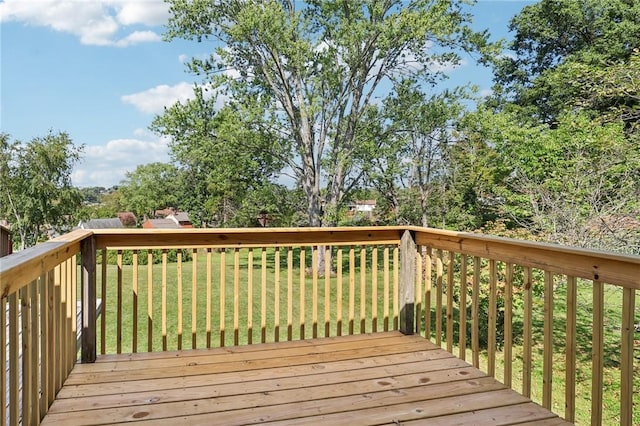 wooden deck with a lawn