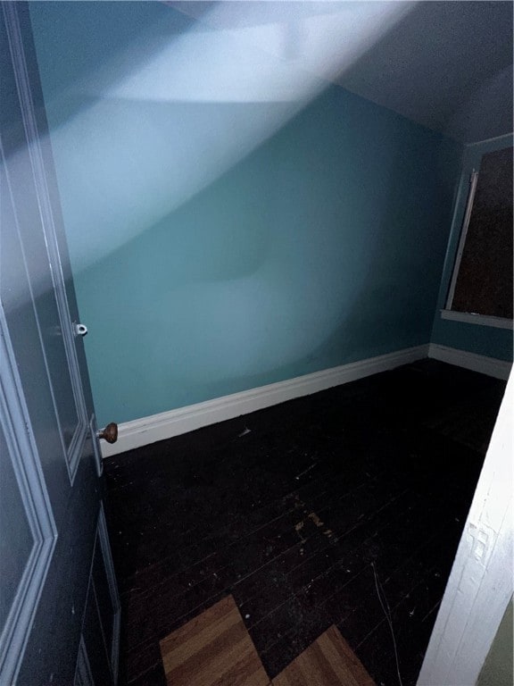 bonus room with dark hardwood / wood-style flooring