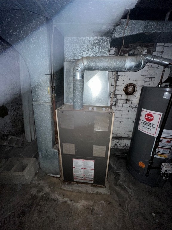 utility room with water heater and heating unit