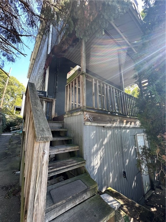 view of side of home featuring a jacuzzi