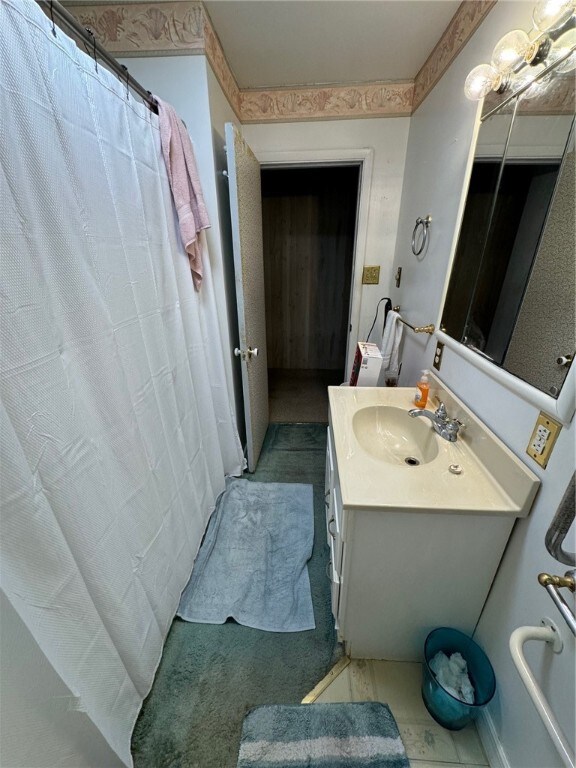 bathroom with vanity and a shower with shower curtain