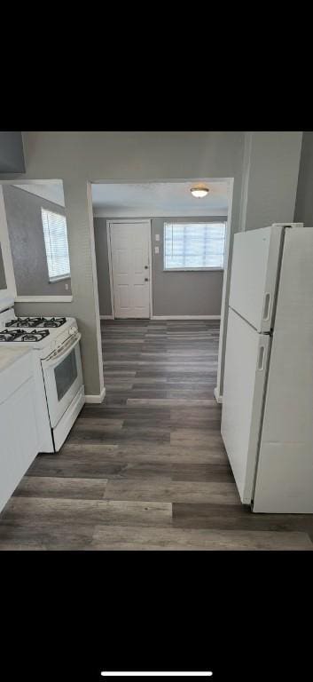 6405 Apple St, Lincoln-Larimer, PA 15206 - kitchen featuring wood finished floors, white appliances, baseboards, light countertops, and white cabinets