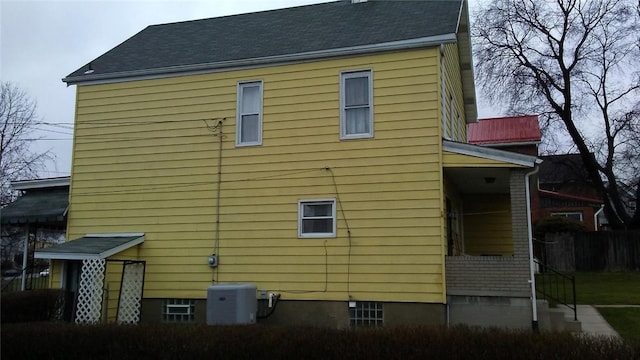 view of side of property featuring central AC unit