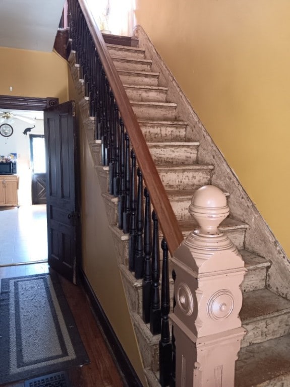 staircase featuring tile patterned floors