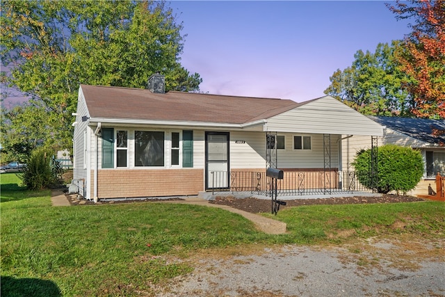 view of front of home with a lawn