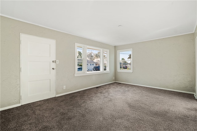 carpeted empty room with ornamental molding