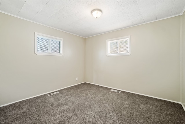 unfurnished room featuring crown molding and carpet flooring