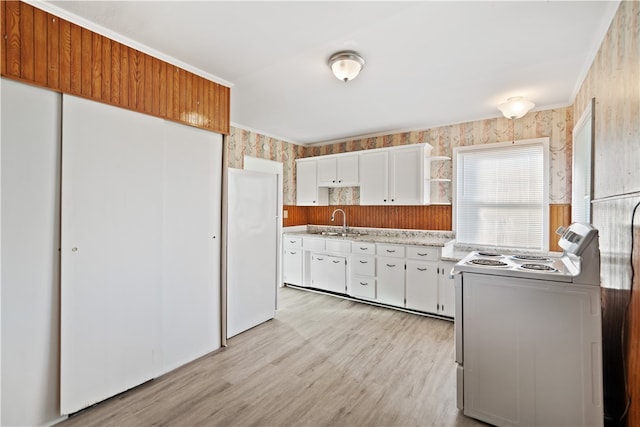 kitchen with light hardwood / wood-style flooring, sink, white appliances, and white cabinetry