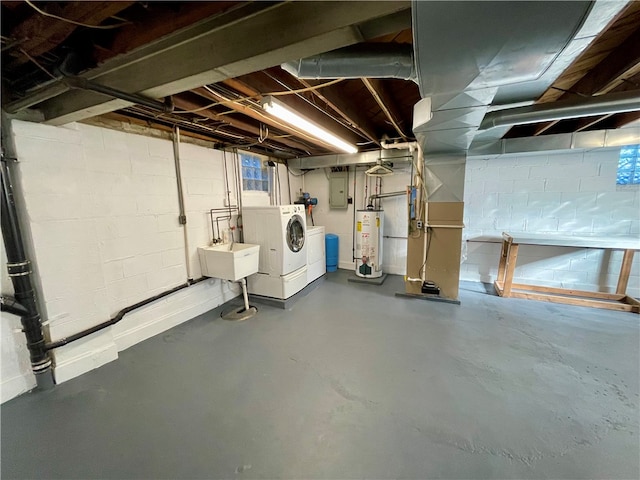 basement with electric panel, separate washer and dryer, water heater, and sink