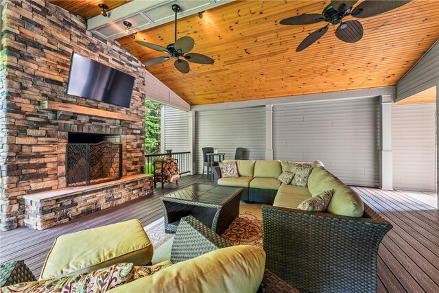 wooden terrace featuring an outdoor living space with a fireplace and ceiling fan