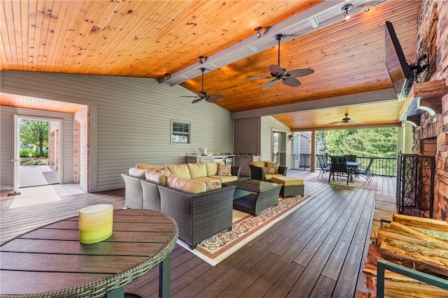 wooden deck featuring ceiling fan and an outdoor hangout area