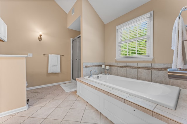 bathroom featuring lofted ceiling, tile patterned floors, and plus walk in shower