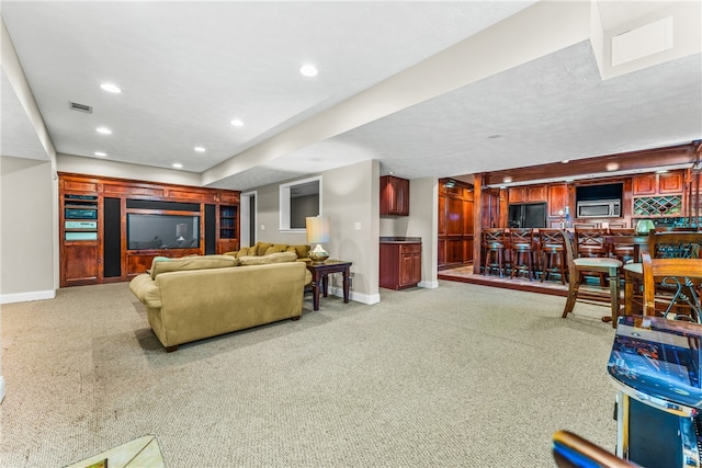 living room featuring light carpet and bar