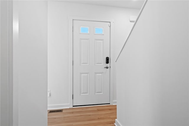 foyer with light hardwood / wood-style flooring