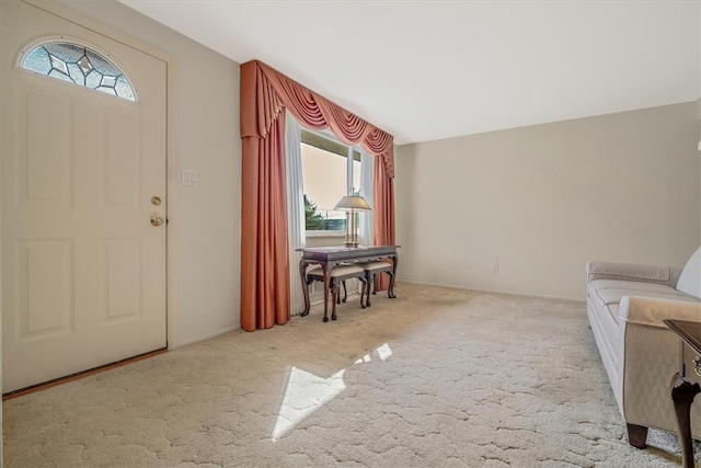 carpeted foyer entrance with plenty of natural light