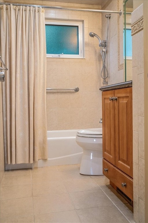 full bathroom featuring tile patterned flooring, shower / bath combo, vanity, and toilet