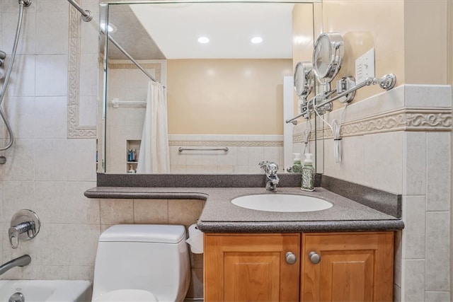 full bathroom with toilet, tile walls, vanity, and shower / bathtub combination with curtain