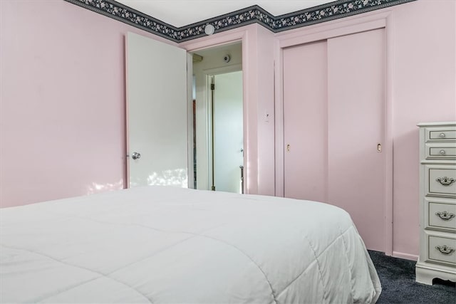 carpeted bedroom with a closet