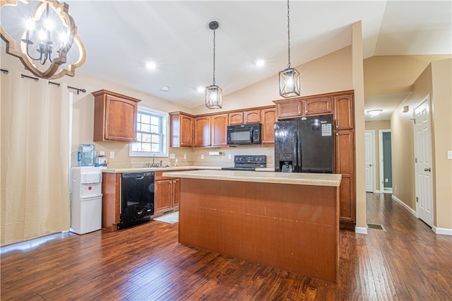 kitchen featuring lofted ceiling, black appliances, dark wood-type flooring, and a kitchen island