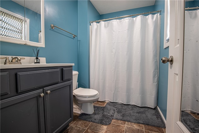 bathroom with vanity, a shower with curtain, toilet, and tile patterned flooring