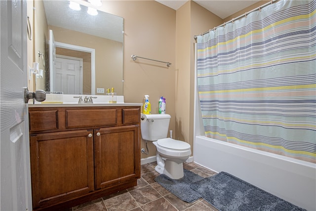 full bathroom featuring vanity, shower / bath combo with shower curtain, and toilet