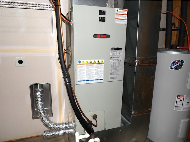 utility room with electric water heater