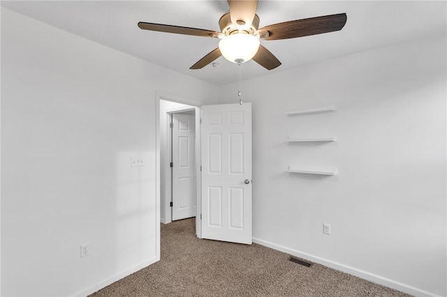 unfurnished bedroom with carpet floors and ceiling fan