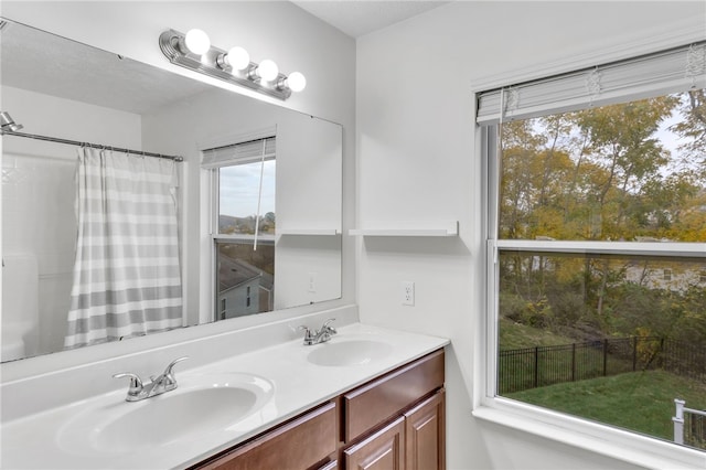 bathroom featuring vanity and walk in shower