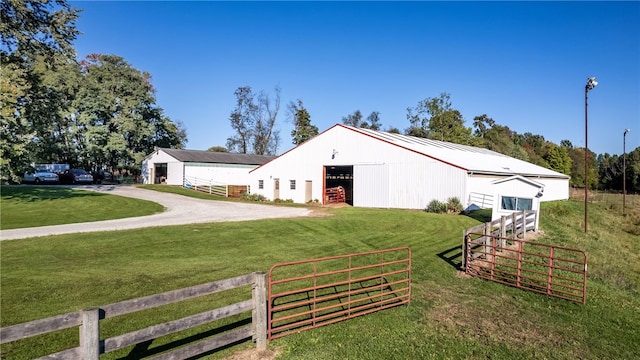 view of front of property with a front yard and an outdoor structure