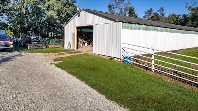 view of outbuilding with a lawn