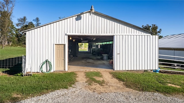 view of outbuilding with a yard