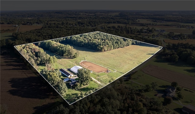 birds eye view of property with a rural view