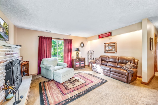 living room featuring a fireplace, carpet, and a textured ceiling