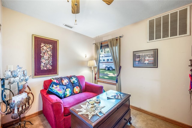 living room featuring ceiling fan and light carpet