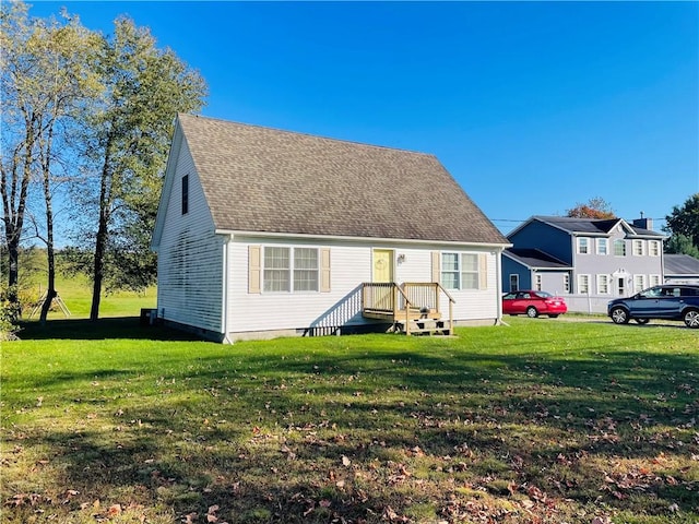 409 Ceylon Rd, Carmichaels/Cumblnd, PA 15320 - cape cod house featuring a front lawn and roof with shingles