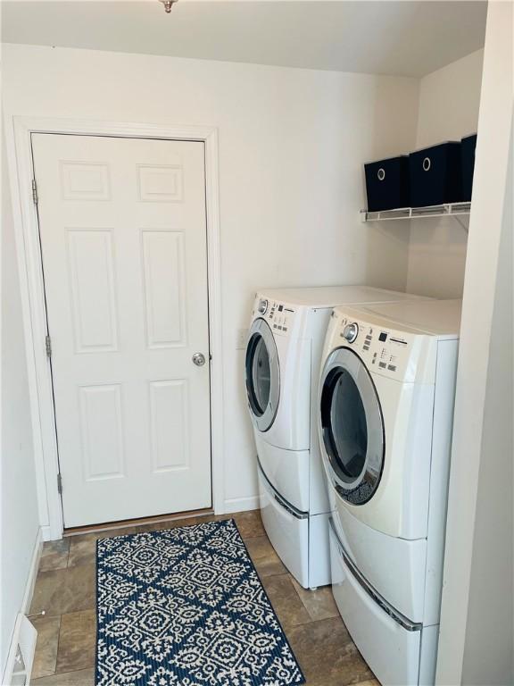 409 Ceylon Rd, Carmichaels/Cumblnd, PA 15320 - washroom featuring washing machine and dryer, stone finish flooring, and baseboards