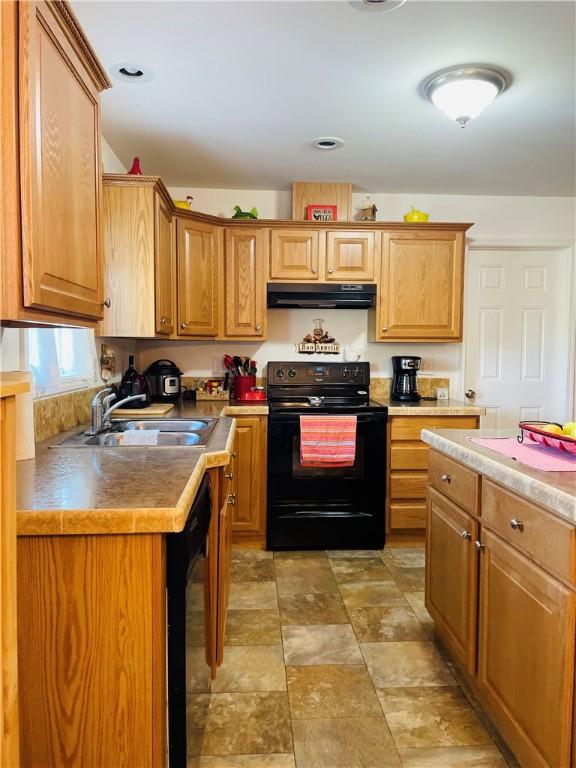 409 Ceylon Rd, Carmichaels/Cumblnd, PA 15320 - kitchen with black appliances, ventilation hood, a sink, stone finish flooring, and light countertops