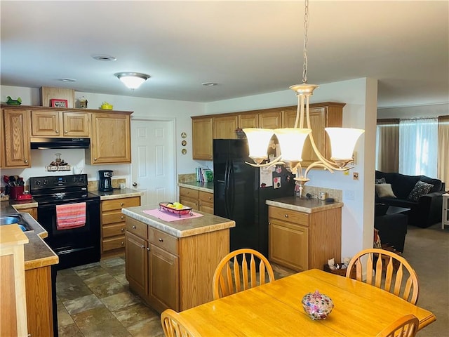 409 Ceylon Rd, Carmichaels/Cumblnd, PA 15320 - kitchen with black appliances, under cabinet range hood, a center island, and light countertops