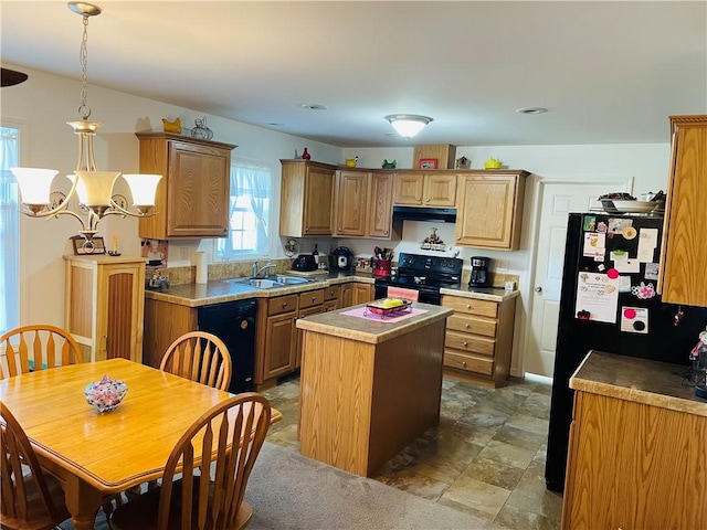 409 Ceylon Rd, Carmichaels/Cumblnd, PA 15320 - kitchen with black appliances, a sink, under cabinet range hood, a kitchen island, and hanging light fixtures