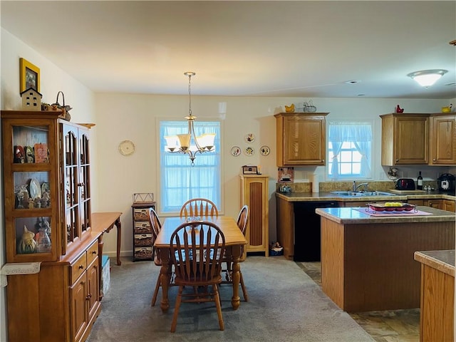 409 Ceylon Rd, Carmichaels/Cumblnd, PA 15320 - kitchen featuring a sink, black dishwasher, a chandelier, brown cabinets, and a center island