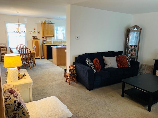 409 Ceylon Rd, Carmichaels/Cumblnd, PA 15320 - living room with a chandelier, light carpet, and plenty of natural light